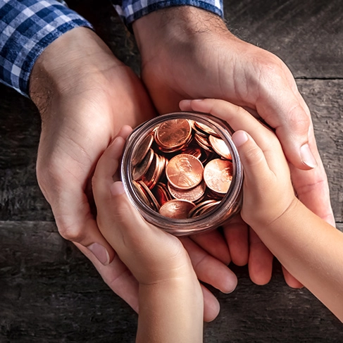 child giving savings to parent